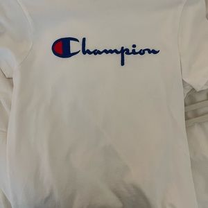 White Champion t shirt, never worn, runs a little big, and fits a little tight.